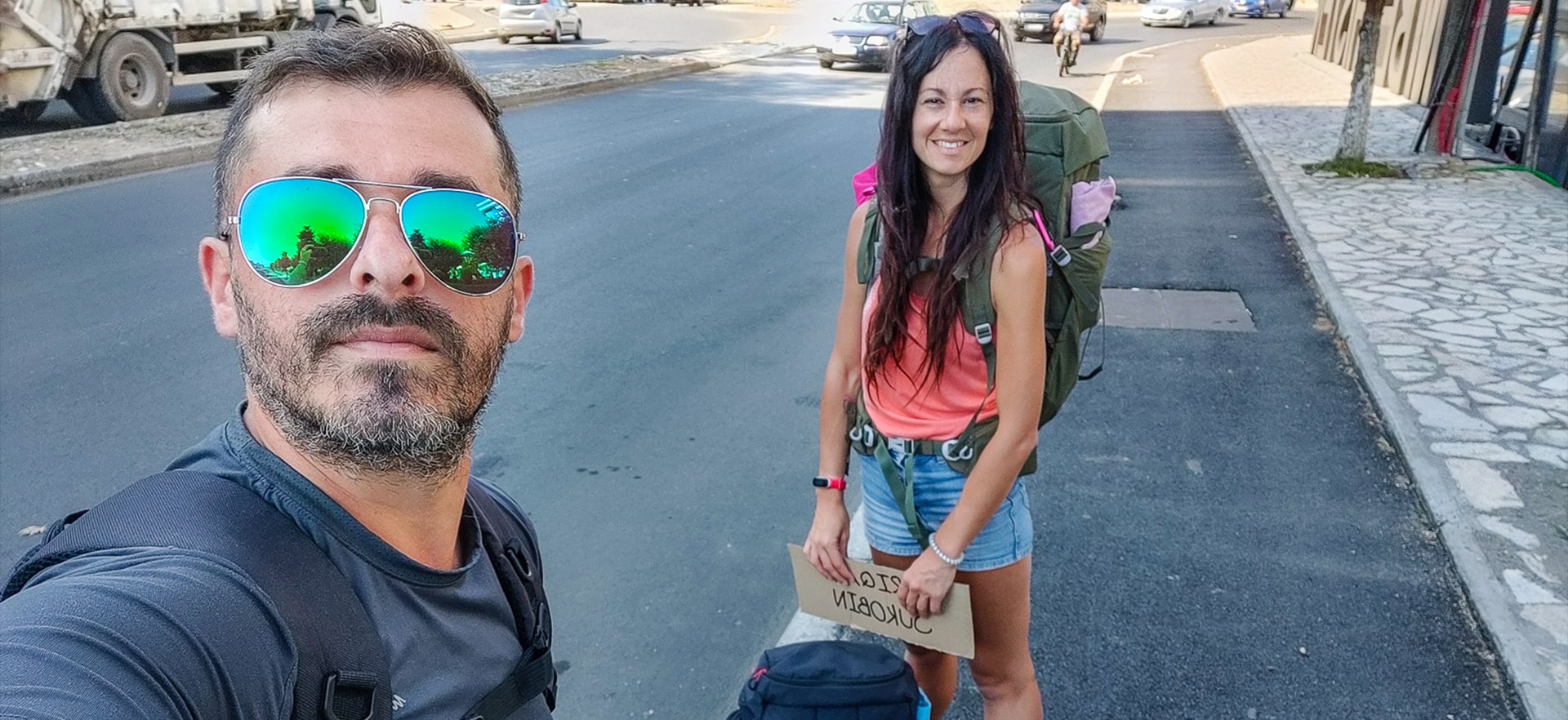 Backpackers hitchhiking