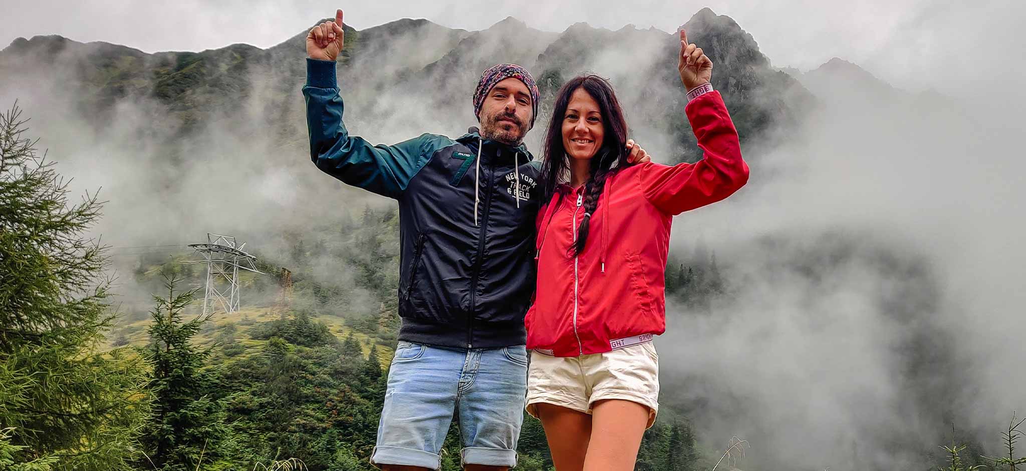 A couple on the mountains in fog