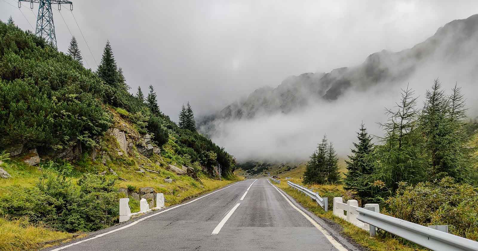 Mountain road with low clouds