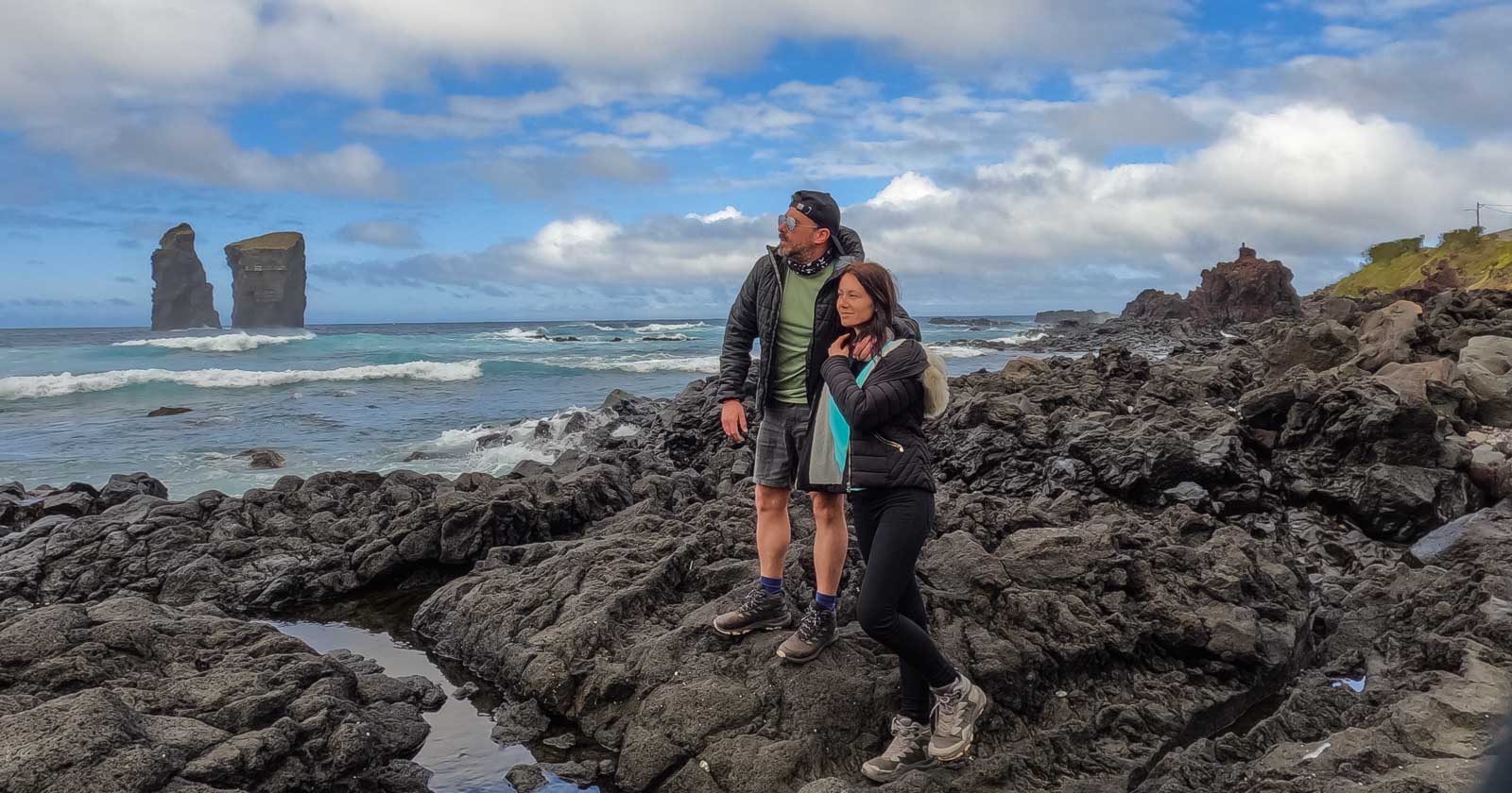 Couple on the Black Beach - Portugal Travel Guide