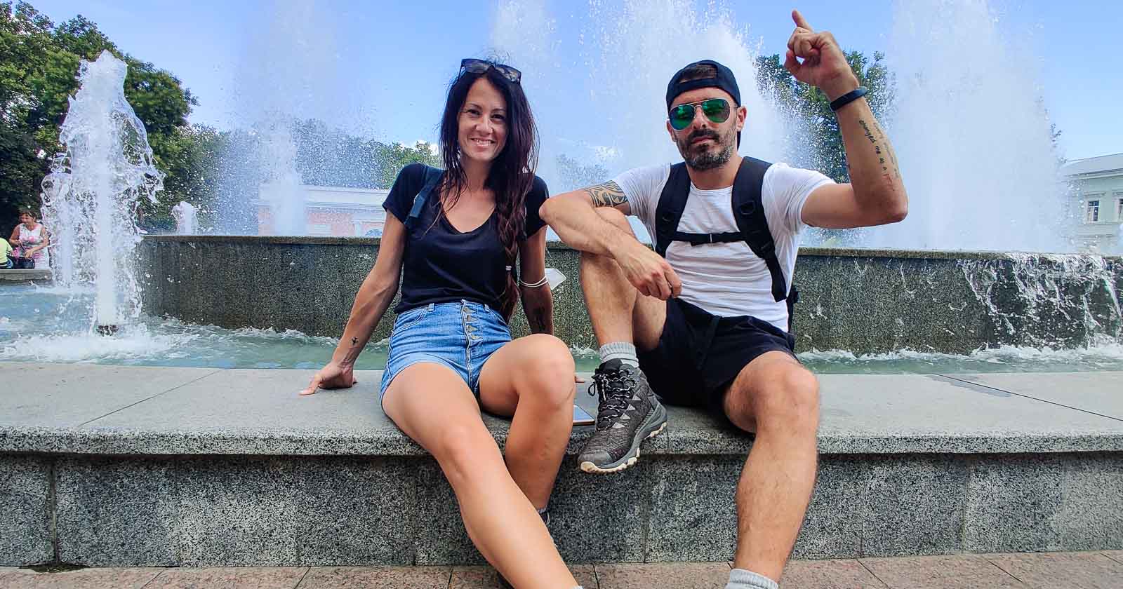 Couple sitting on a fountain in Odesa Ukraine